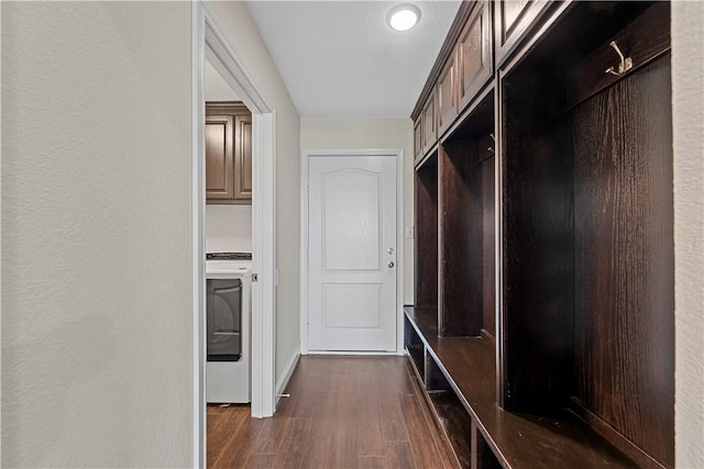 mudroom featuring washer / clothes dryer and dark wood-type flooring