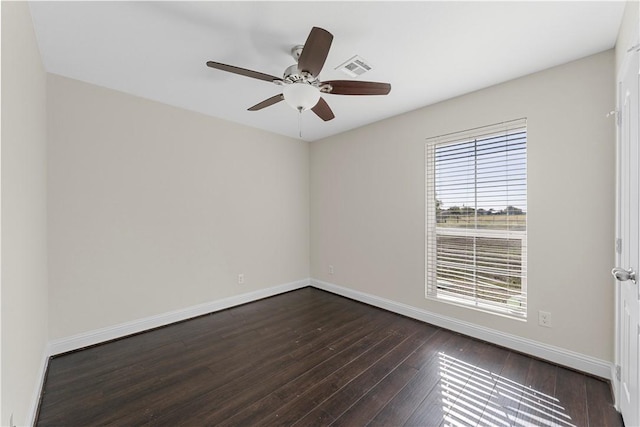 spare room featuring ceiling fan and dark hardwood / wood-style flooring