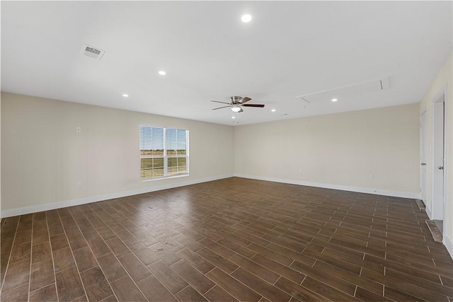 unfurnished room with ceiling fan and dark hardwood / wood-style flooring