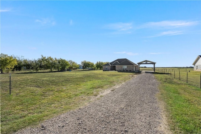 view of yard with a rural view