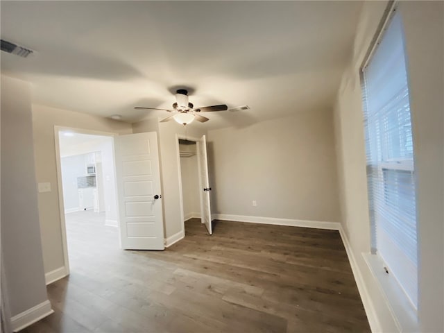 unfurnished room with hardwood / wood-style flooring and ceiling fan