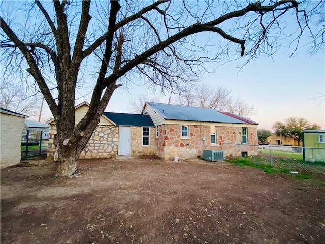 view of back house at dusk