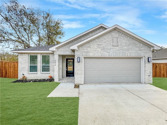 ranch-style home featuring a garage and a front lawn