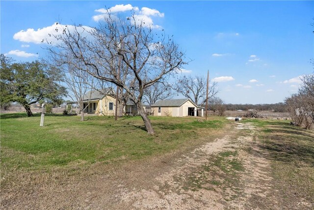 exterior space featuring a front yard and driveway