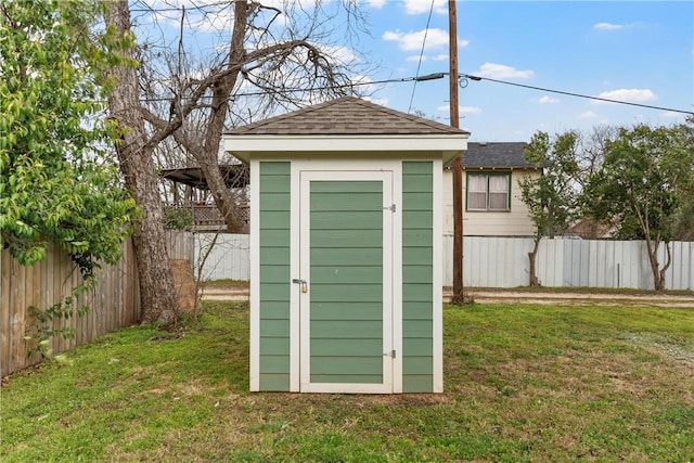 view of shed with a fenced backyard