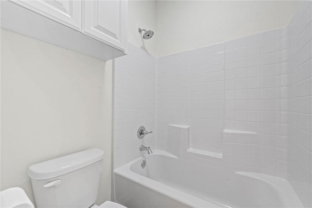 bathroom with toilet and tub / shower combination