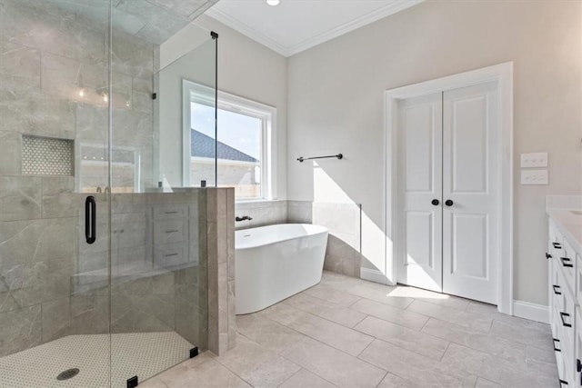 bathroom with tile patterned floors, vanity, separate shower and tub, and crown molding