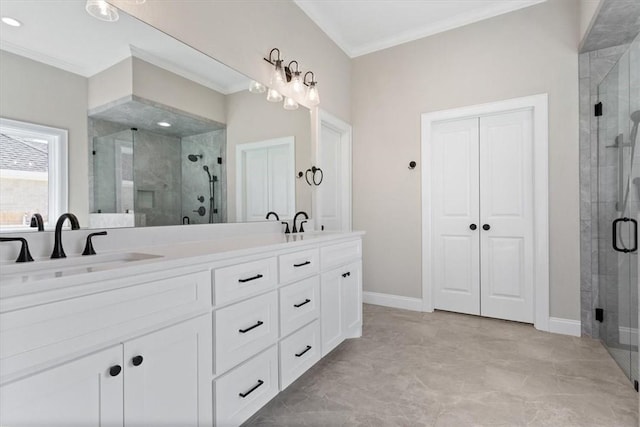 bathroom featuring vanity, a shower with shower door, and ornamental molding