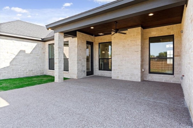 view of patio featuring ceiling fan