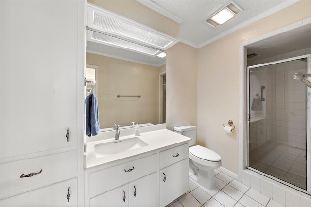 full bath featuring crown molding, toilet, a stall shower, vanity, and tile patterned flooring