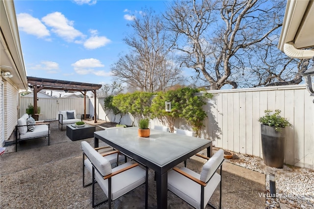 view of patio / terrace with outdoor dining area, a fenced backyard, and a pergola