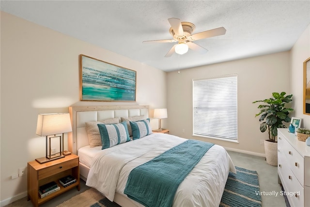 bedroom with light carpet, ceiling fan, a textured ceiling, and baseboards