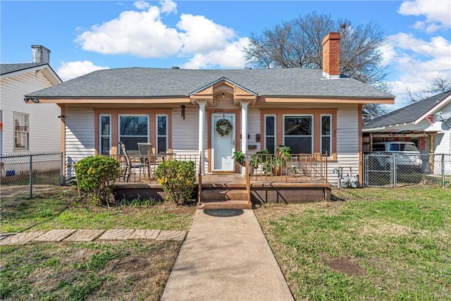 bungalow-style house with a front yard and a porch