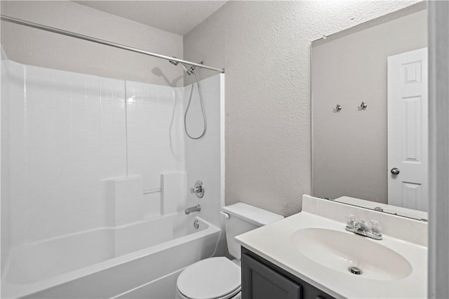 full bathroom with washtub / shower combination, a textured ceiling, vanity, and toilet