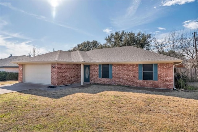 ranch-style home featuring a garage, driveway, brick siding, fence, and a front yard