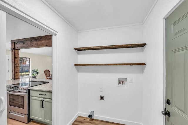 laundry area featuring washer hookup, light wood-style floors, ornamental molding, hookup for an electric dryer, and baseboards