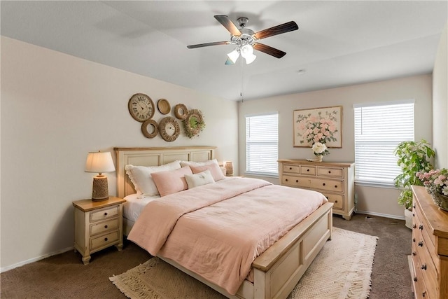 bedroom with ceiling fan and dark colored carpet