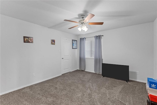 spare room with carpet flooring and ceiling fan