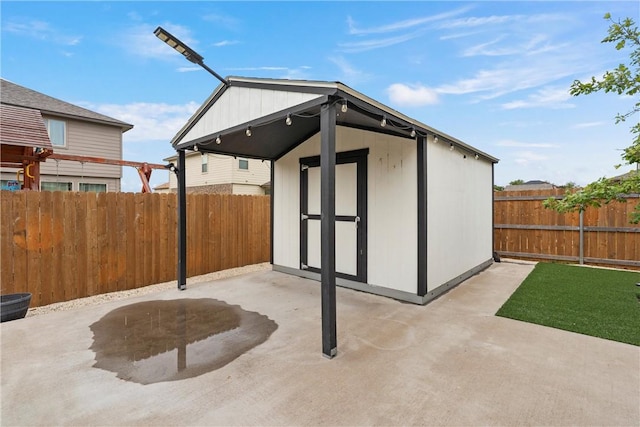 view of patio featuring a storage shed