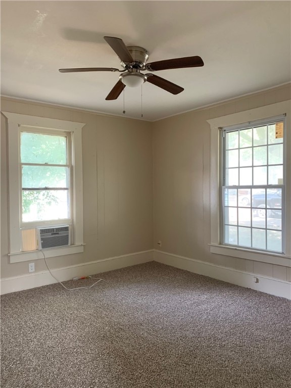 spare room featuring ornamental molding, carpet floors, ceiling fan, and cooling unit