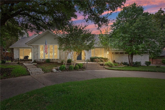 view of front of home featuring a yard