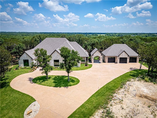 view of front of home featuring a garage and a front lawn