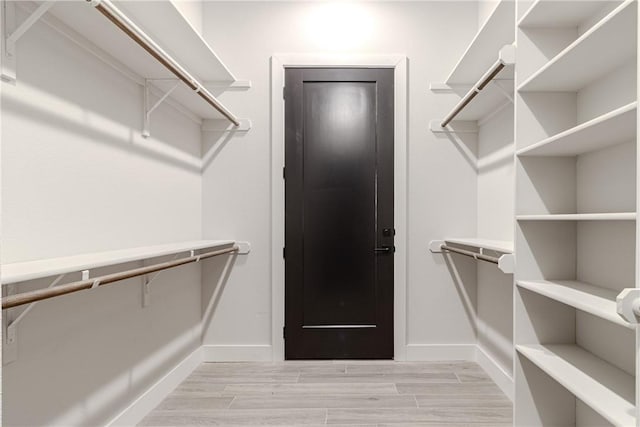 walk in closet featuring light wood-type flooring