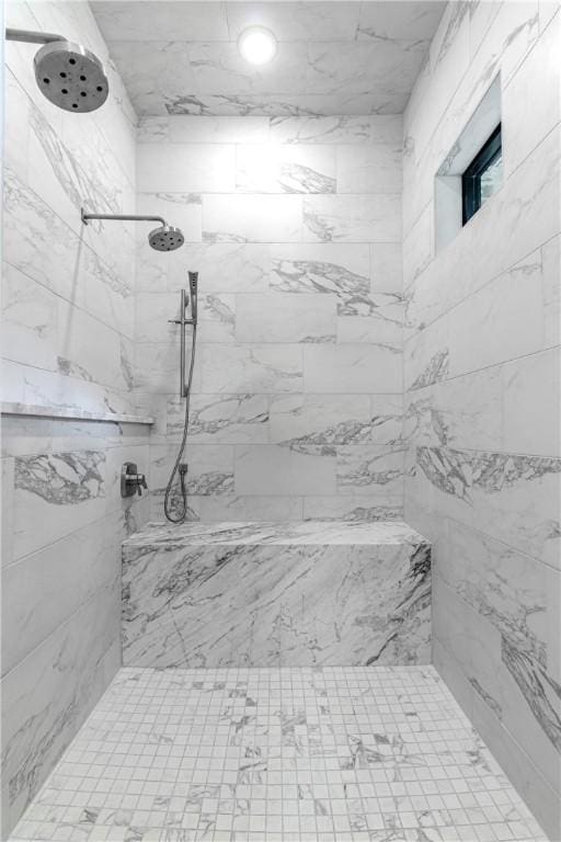 bathroom featuring a tile shower