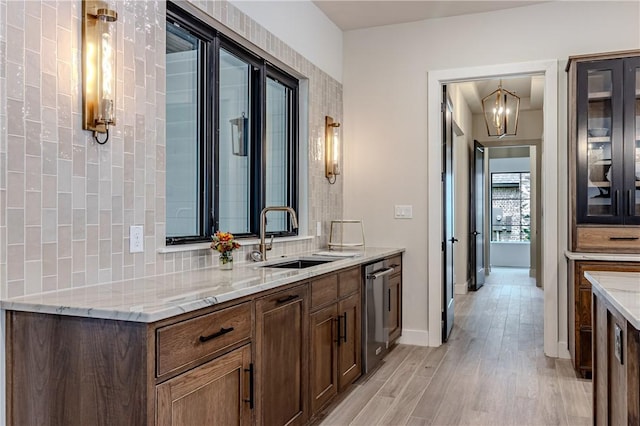 bathroom featuring vanity, backsplash, a notable chandelier, and wood-type flooring