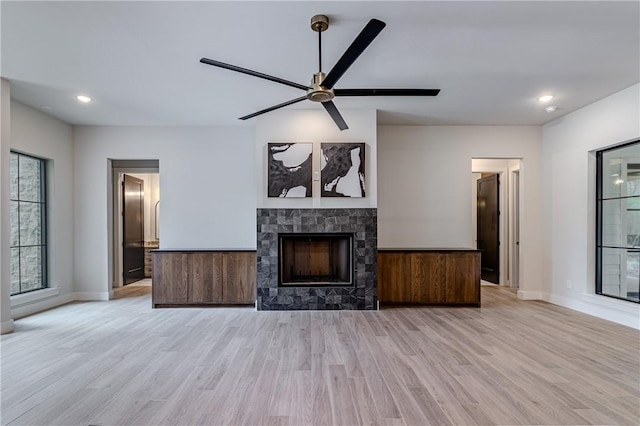 unfurnished living room with ceiling fan and light hardwood / wood-style floors