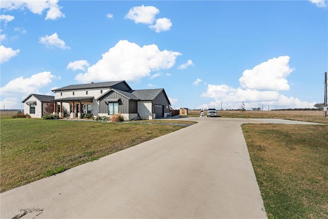 exterior space with a garage and a front lawn