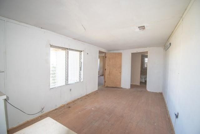 unfurnished bedroom featuring light wood finished floors