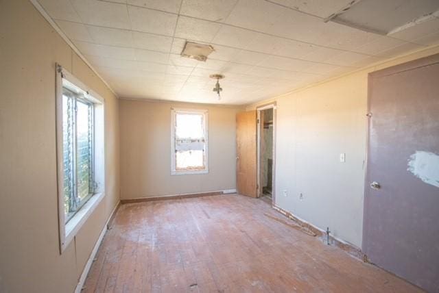 spare room featuring wood-type flooring