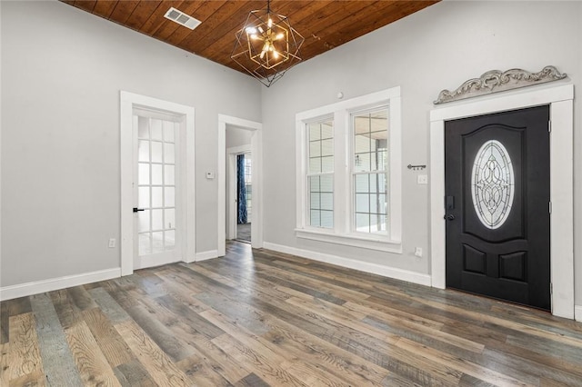 entrance foyer with a chandelier, dark hardwood / wood-style flooring, wooden ceiling, and lofted ceiling