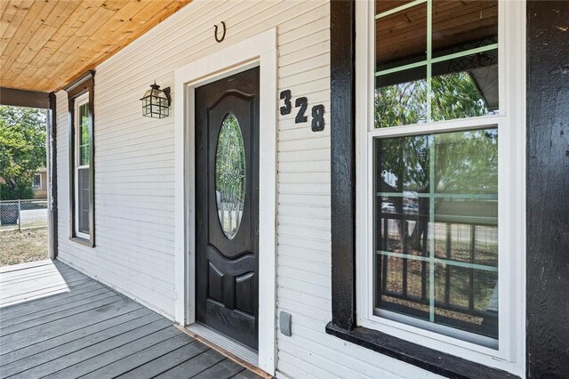 doorway to property with a porch