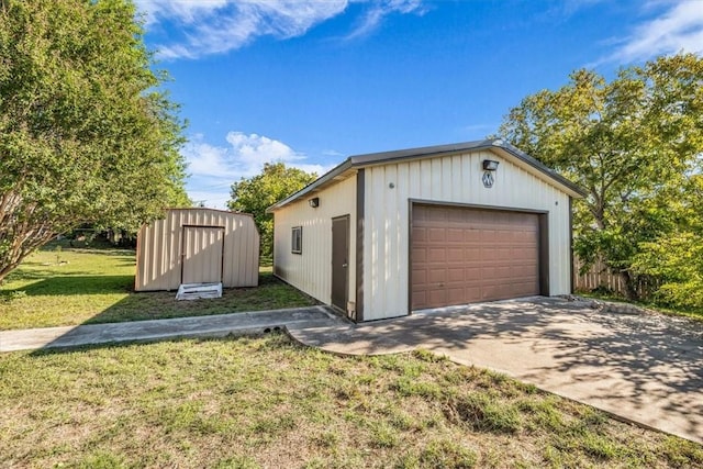 garage featuring a lawn