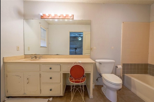 full bathroom with tile patterned floors, vanity, shower with separate bathtub, and toilet