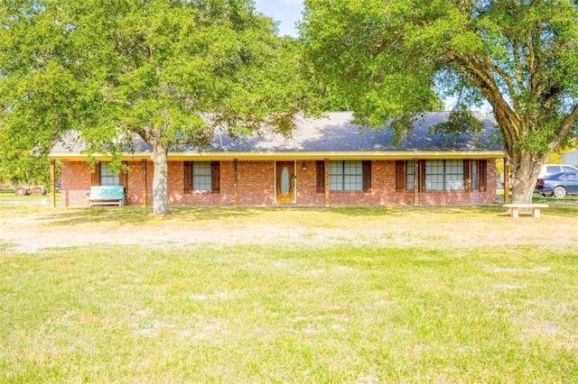 ranch-style home featuring a front yard