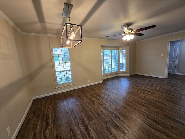 unfurnished room featuring ornamental molding, dark wood-type flooring, and a wealth of natural light