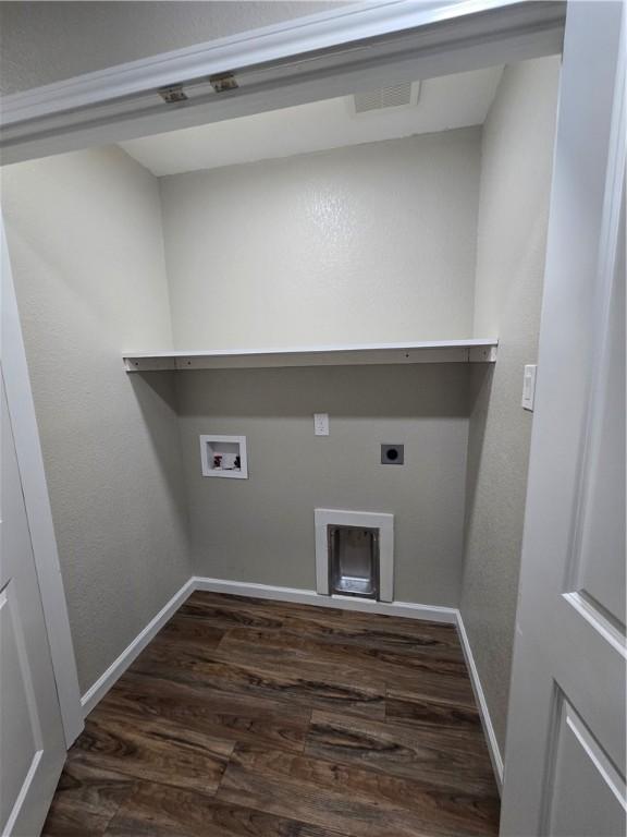 laundry room featuring hookup for a washing machine, dark wood-type flooring, and hookup for an electric dryer