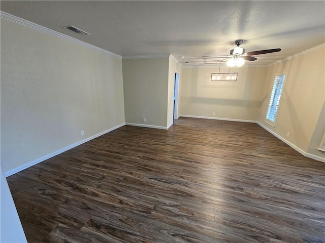 spare room featuring ceiling fan, dark hardwood / wood-style flooring, and ornamental molding