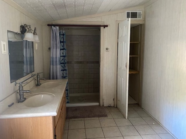 bathroom featuring a shower with curtain, tile patterned flooring, vanity, and lofted ceiling