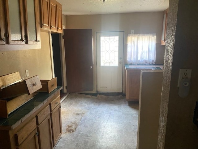 kitchen featuring tile countertops