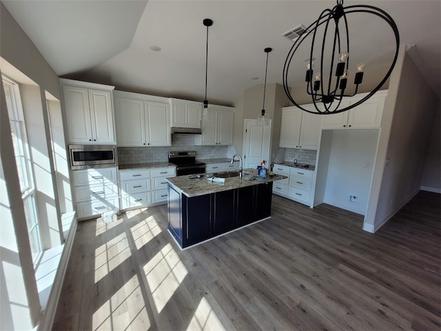 kitchen featuring stainless steel appliances, an island with sink, hanging light fixtures, and white cabinets