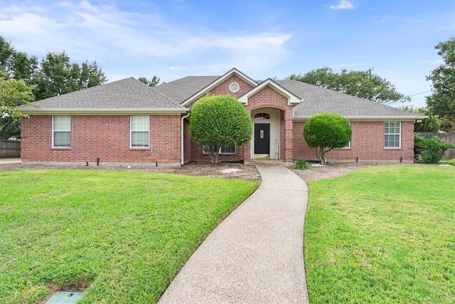 ranch-style home with a front yard