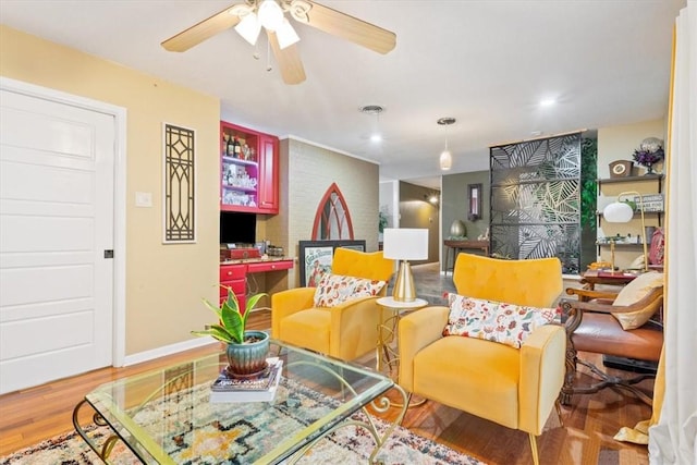 sitting room with hardwood / wood-style floors