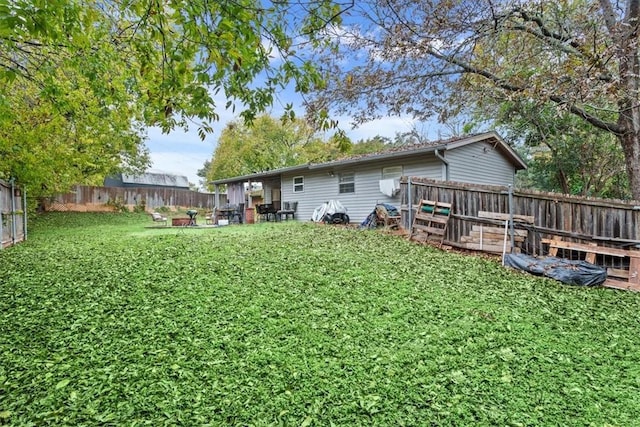 back of house featuring a yard