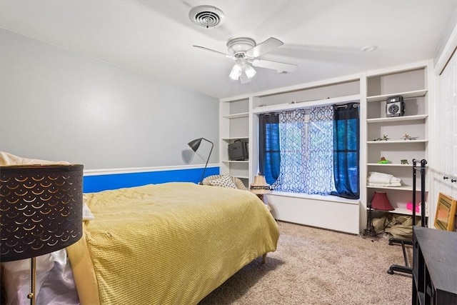 bedroom with ceiling fan and carpet floors