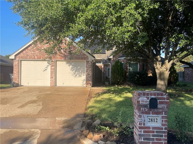 obstructed view of property featuring a front lawn