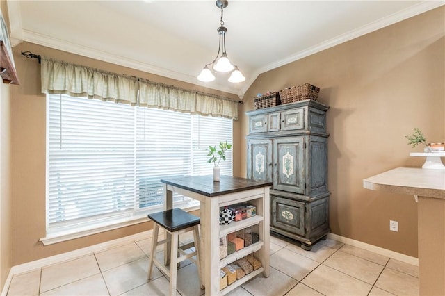 dining space featuring vaulted ceiling, crown molding, and light tile patterned flooring